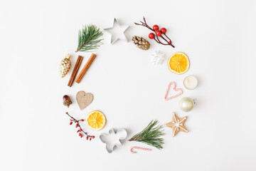 Trendy creative Christmas, winter, new year composition. Fir tree branches, Christmas decorations on white background. Flat lay, top view, copy space