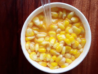 Sweet corns boiled in a cup.