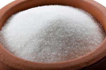Granulated sugar in bowl. Crystals of refined table sugar. Sweet soluble carbohydrates. Sucrose, disaccharide of glucose and fructose.