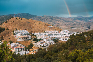 Malaga, Spain. Cityscape aerial view of residential district. residential houses. real estate. Altered Sky With Rainbow