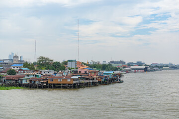 Fototapeta na wymiar Landscape of houses and buildings near Chao Phraya River, Bangkok, Thailand