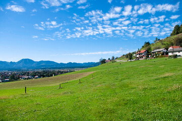 Fototapeta premium panoramic view of beautiful green hill on blue sky background, in valley of Slovenia. Copy space for text.