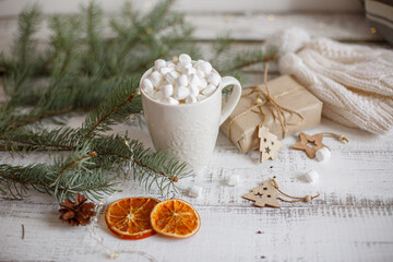 Obraz na płótnie Canvas Christmas composition, mug with cocoa and marmalade on a wooden background