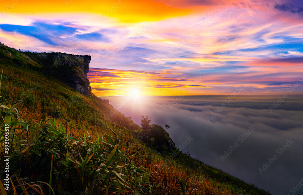 Wall mural sunrise and mist mountain in phu chi fa located in chiang rai, thailand. phu chi fa is the natural b