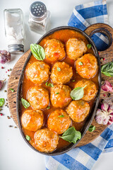 Homemade beef meatballs in tomato marinara sauce.