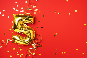Gold foil balloon number and digit five 5. Birthday greeting card. Anniversary celebration event....