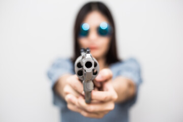 Beautiful asian women hold .44 magnum revolver gun on white background