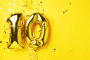 Gold foil balloon number, digit ten. Birthday greeting card, inscription 10. Anniversary celebration event. Banner. Golden numeral, yellow background. Numerical digit, bright shiny glitter