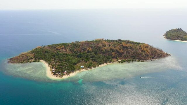 Tropical landscape: islands with beautiful sandy beaches by turquoise water view from above. Bobo Island, Baong Island. Mindanao, Philippines.