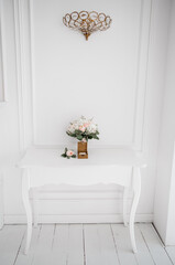 wooden box for wedding rings with bridal bouquet on white table