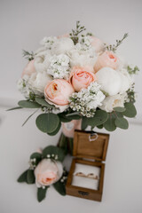 wooden box for wedding rings with bridal bouquet