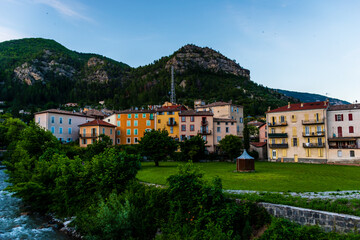 Fototapeta na wymiar A picturesque wide angle view of a French alpine medieval village during sunset in summer (Puget-Theniers, Alpes-Maritimes, Provence-Alpes-Cote-d'Azur, France)