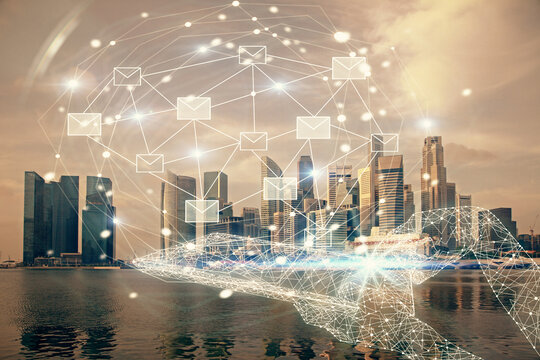 Double exposure of envelop hologram flying from gadget and city view background. Concept e-mail.