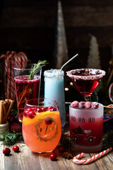 Various Christmas cocktails against a dark background. 