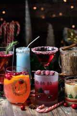 Assorted Christmas cocktails against a dark festive background.