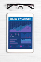 Online investment. Tablet with a mobile app with graphs and charts. Analysis of business processes or exchange trading
