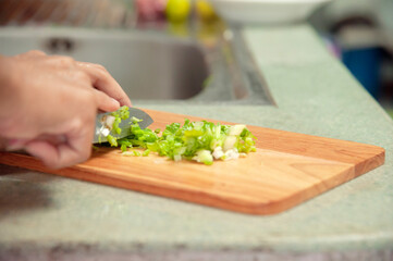 Cutting Coriander and spring onions are used for decorating Thai food.