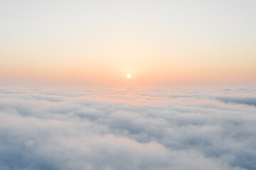 View of above the clouds during the sunrise