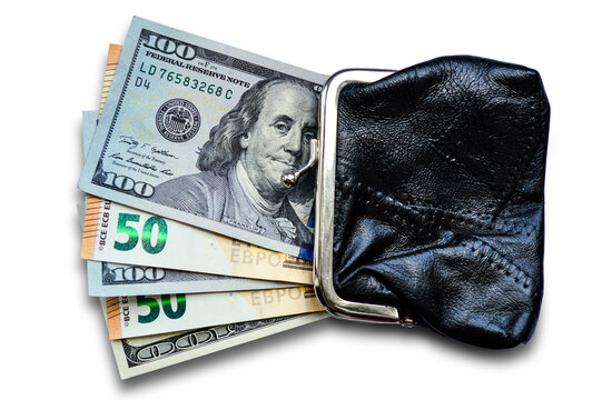 Dollar and euro bills sticking out of a black wallet