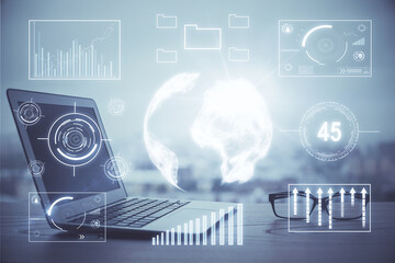 Stock market graph and table with computer background. Double exposure. Concept of financial analysis.