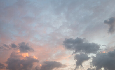 sky in the evening with light red and clouds in different shades of grey