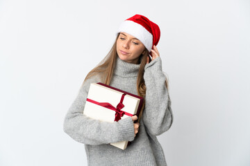 Lithianian woman with christmas hat holding presents isolated on white background having doubts