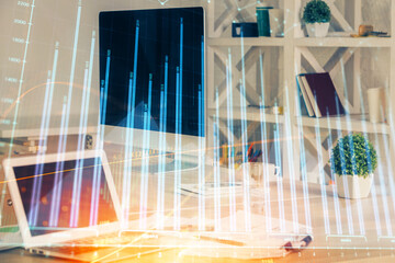 Forex market graph hologram and personal computer on background. Double exposure. Concept of investment.