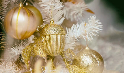 Christmas ornaments. Xmas tree decoration, gold color baubles, holiday background,