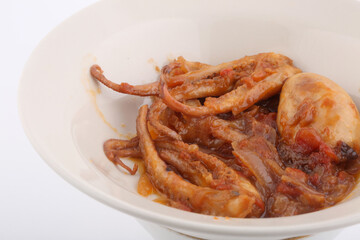 octopus cooked with onions and white rice side