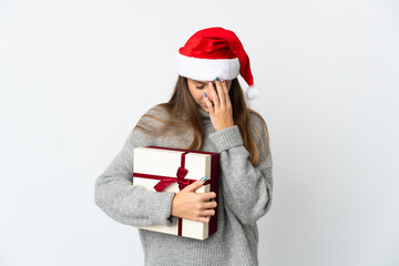 Lithianian woman with christmas hat holding presents isolated on white background with tired and sick expression