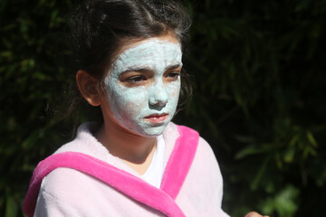 girl with face care mask cream