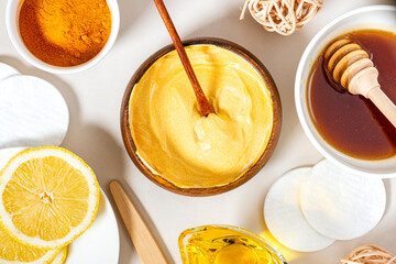 Homemade face mask from turmeric, yoghurt, and honey. Ayurvedic skin care. Beauty, homemade skin care concept