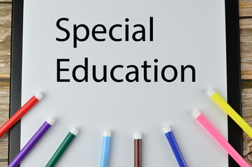 Top view of various of colors and paper holding file written with text SPECIAL EDUCATION. Education concept. 