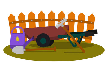 Concept of gardening. Garden tools. Different gardening equipment and tools against wood fence. Wheelbarrow, watering can, shovel.Organic farming. Wheelbarrow with tools to work in the garden. 