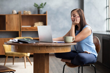 Beautiful young womanresting during working day closing eyes.