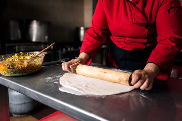Chef kneading bread dough
