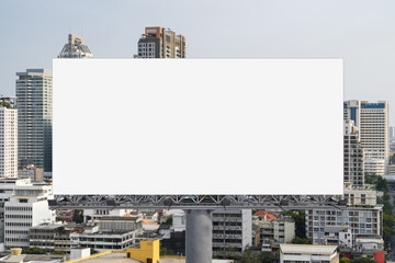 Blank white road billboard with Bangkok cityscape background at day time. Street advertising poster, mock up, 3D rendering. Front view. The concept of marketing communication to promote or sell idea.