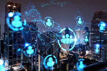 Glowing Social media icons on night panoramic city view of Bangkok, Asia. The concept of networking and establishing new connections between people and businesses. Double exposure.