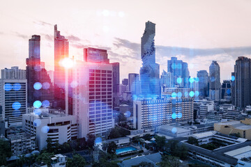 Obraz premium Glowing hologram of Earth planet map on aerial panoramic cityscape of Bangkok at sunset, Asia. The concept of international business. Multi Exposure.