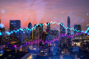 Glowing FOREX graph hologram, aerial panoramic cityscape of Bangkok at sunset. Stock and bond trading in Asia. The concept of fund management. Double exposure.