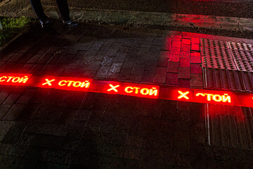 Light sign stop (written in Russian) at the pedestrian crossing