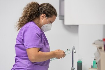 Veterinarian checking the data of a pet to be operated