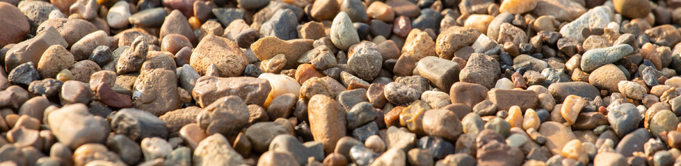 background of stone pebbles on the seashore