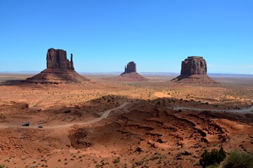 Monument Valley in Arizona, USA, with partial shadow, west mitten butte, east mitten butte, Merrick butte, Navajo Nation Reservation, afternoon light