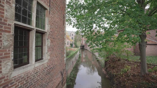 Dijle river runs through the great beguinage (Groot Begijnhof) in Leuven, Belgium