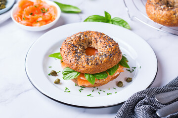 Plating, fast lunch, meal. Bagels with cream cheese and salmon