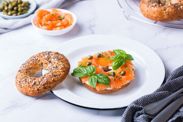 Plating, fast lunch, meal. Bagels with cream cheese and salmon