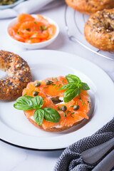 Plating, fast lunch, meal. Bagels with cream cheese and salmon