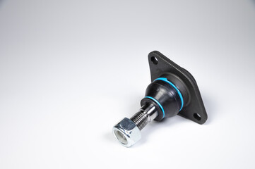 Ball joint car suspension on a gray background. New spare parts axel car elements