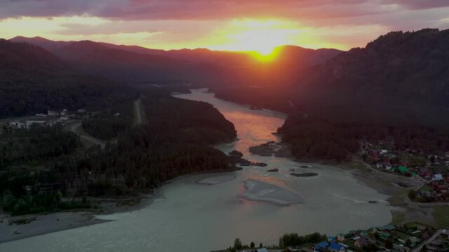 The mountain river view from high. Mountain landscapes. Pink sunset